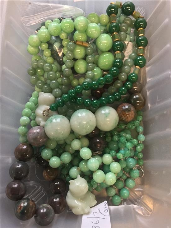 Quantity of mainly glass beads with two jade carvings and a Jasper necklace(-)